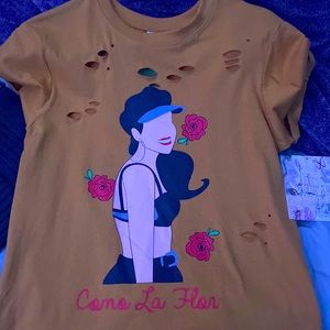 Yellow orangish colors selena shirt in a size small.